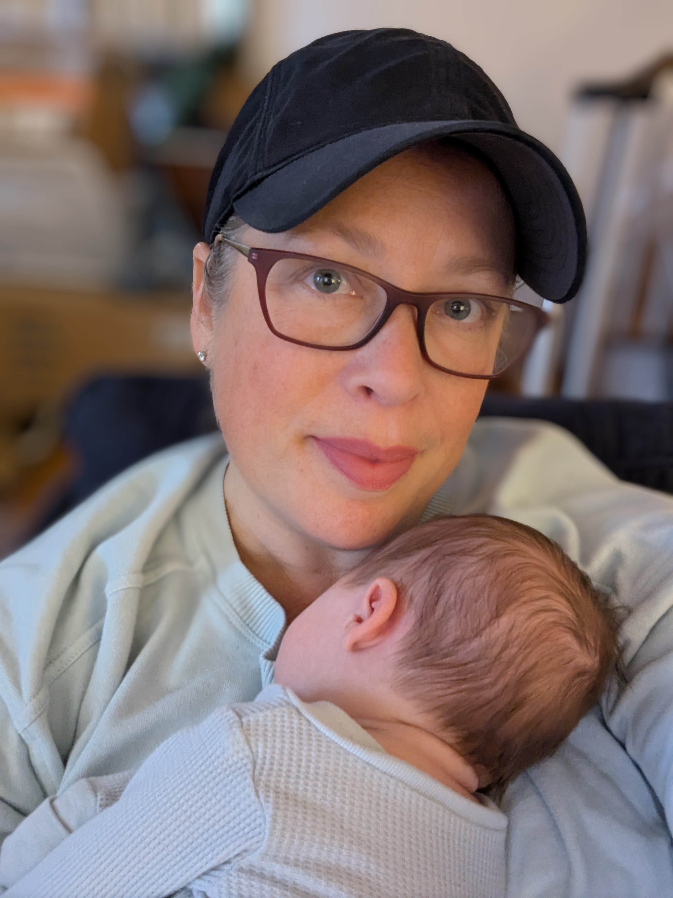 Jody Israel providing postpartum doula care to a newborn