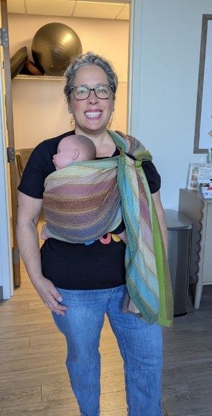 Jody holding a newborn baby
